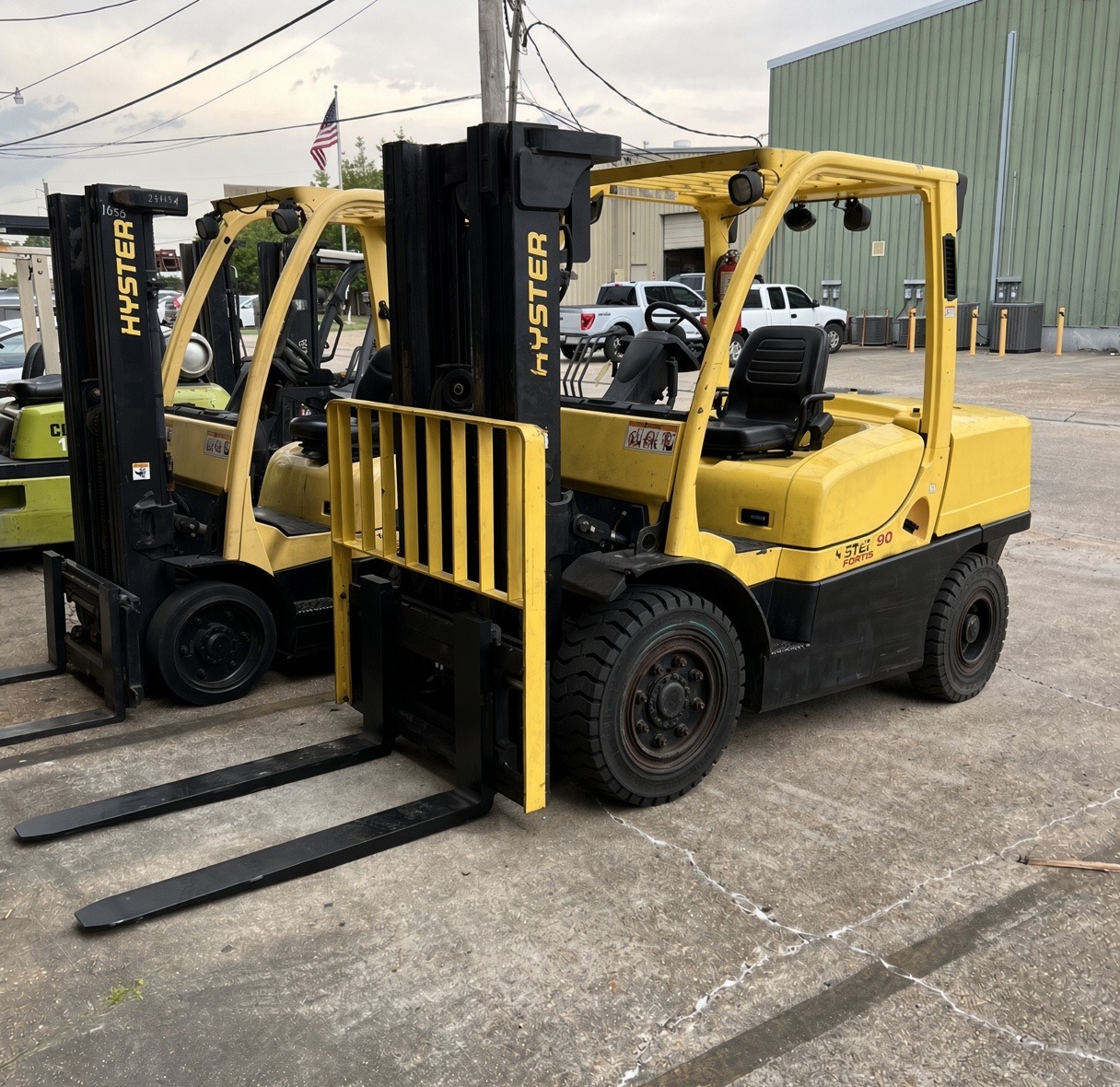 Yellow Hyster forklifts in the yard